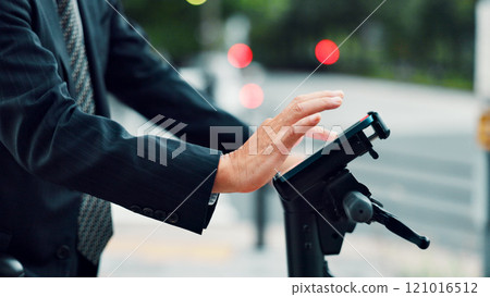 Hands, person and phone on ebike in city for travel directions, sustainable transport and networking. Worker, typing and mobile on electric bicycle with communication, navigation and commute in Japan 121016512