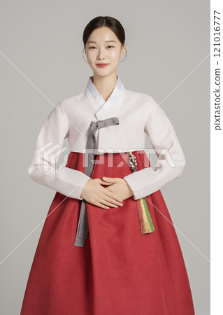A woman in her 20s wearing a hanbok and standing in an elegant posture A woman in her 20s wearing a hanbok and standing in an elegant posture 121016777