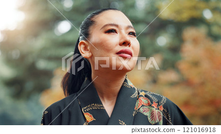 Woman, thinking and reflection in nature for idea, peace and mindset for martial arts practice in Tokyo. Japanese samurai, daydreaming and relax in park with nostalgia, memories and culture in sport Woman, thinking and reflection in nature for idea, peace and mindset for martial arts practice in Tokyo. Japanese samurai, daydreaming and relax in park with nostalgia, memories and culture in sport 121016918