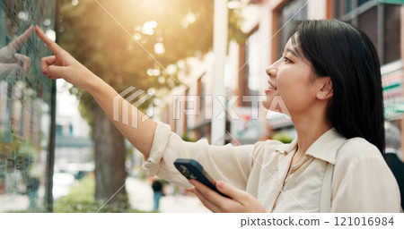 Asian woman, phone or tourist with city map for information, guide or directions in urban town. Japan, female person or tourism with mobile smartphone or self service navigation for point of interest Asian woman, phone or tourist with city map for information, guide or directions in urban town. Japan, female person or tourism with mobile smartphone or self service navigation for point of interest 121016984