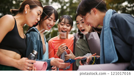 Fitness, people and surprised with phone outdoor for yoga routine video, pilates class announcement and research. Japanese group, smartphone and shocked at park for social media tips or online lesson 121017016