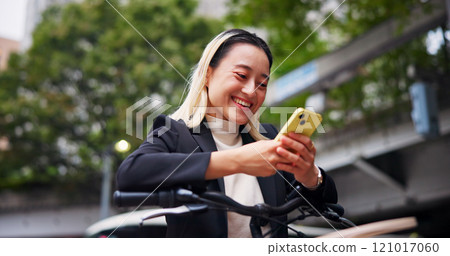 Phone, bicycle and happy business woman on chat app, email and cycling on commute to work in Japan. Mobile, smile or person on bike in city to travel on sustainable transport, text or reading message 121017060