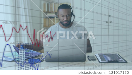 Image of financial data processing over african american man using laptop Image of financial data processing over african american man using laptop 121017150