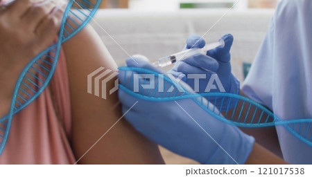 Image of dna strands over biracial woman being vaccinated 121017538