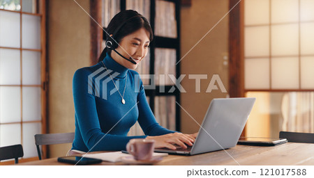 Customer service, laptop or Asian woman in call center or home office for international technical support. Typing, translator and agent in online consultation for multilingual translation in Japan Customer service, laptop or Asian woman in call center or home office for international technical support. Typing, translator and agent in online consultation for multilingual translation in Japan 121017588