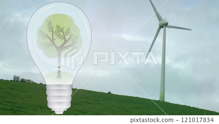 Image of tree in light bulb over wind turbine in green landscape Image of tree in light bulb over wind turbine in green landscape 121017834