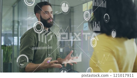 Image of financial data processing over diverse colleagues discussing work in office 121017911