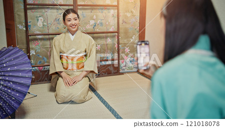 Kimono, photography and phone with Japanese people in store for online shopping, fabric and fashion. Picture, small business and traditional clothes with women and mobile for picture and designer 121018078