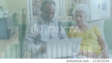 Image of data processing over diverse senior couple using laptop 121018194