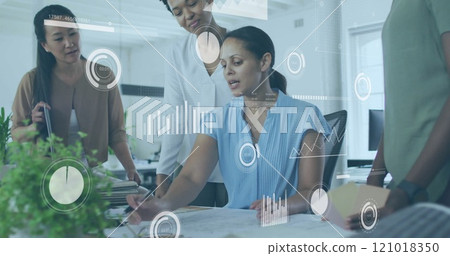 Business data analytics image over diverse team collaborating in modern office Business data analytics image over diverse team collaborating in modern office 121018350
