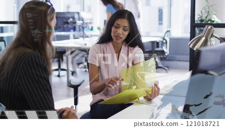 Image of financial data processing over diverse business people in office 121018721
