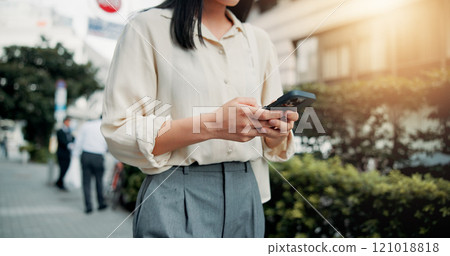 Phone, hands and woman in city for networking, communication or typing email on vacation. Cellphone, contact and female person reading online blog for holiday tips or advice in town in Japan. 121018818