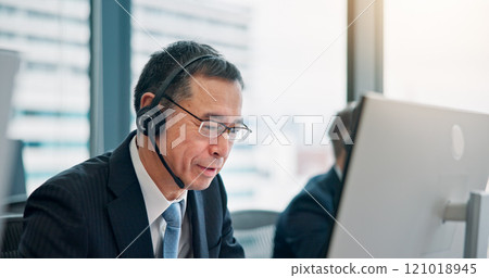 Mic, businessman and consulting with computer for call center, crm system and research for customer. Office, support and mature agent with headset for communication, telemarketing or service in Japan Mic, businessman and consulting with computer for call center, crm system and research for customer. Office, support and mature agent with headset for communication, telemarketing or service in Japan 121018945