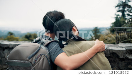 Love, hug and back of couple in nature with bonding together for romantic getaway for anniversary. Care, travel and man and woman embracing for connection by outdoor balcony on vacation in Japan. 121018952