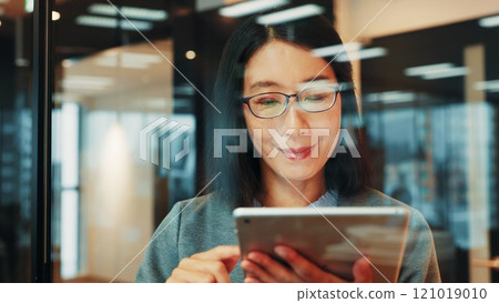 Business, tablet and mature Asian woman in office online for website, research and project review. Corporate, professional and person on digital tech for planning, internet and networking in Japan Business, tablet and mature Asian woman in office online for website, research and project review. Corporate, professional and person on digital tech for planning, internet and networking in Japan 121019010