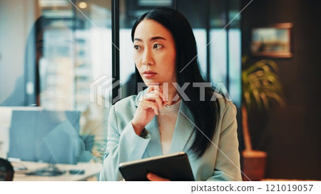 Office, lawyer and businesswoman with tablet for ideas, policy review and digital solution for law firm. Japanese, female person and attorney with thinking for court case, justice report and planning 121019057