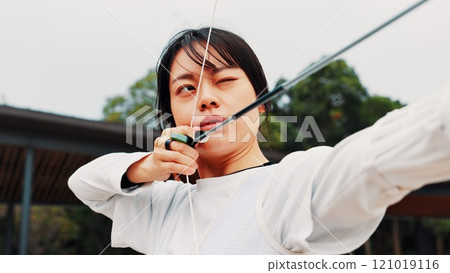 Woman, archery and arrow at field with sport for shooting practice and training as athlete in Japan. Tournament, female person and setup recurve bow or equipment for challenge, game and competition Woman, archery and arrow at field with sport for shooting practice and training as athlete in Japan. Tournament, female person and setup recurve bow or equipment for challenge, game and competition 121019116