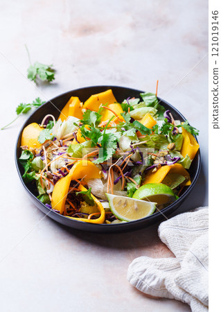 Vietnamese mango salad with nuts and vegetables. Vietnamese mango salad with nuts and vegetables. 121019146
