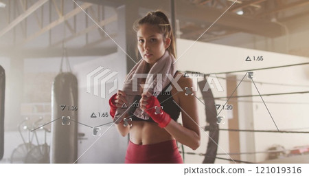 Image of financial data processing over biracial female boxer 121019316