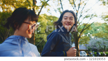 Running, love or happy couple in park for fitness, wellness or health with smile or energy in Japan. Athletes, training or people in outdoor jog with nature together for cardio exercise and workout Running, love or happy couple in park for fitness, wellness or health with smile or energy in Japan. Athletes, training or people in outdoor jog with nature together for cardio exercise and workout 121019353