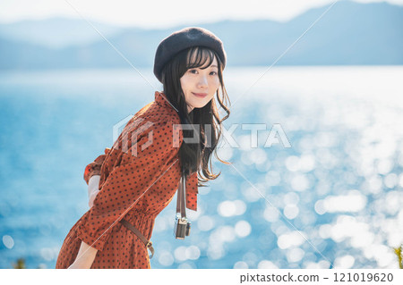Women's trip: Woman looking at the lake 121019620