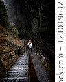 Embarking on an Adventurous Descent in a Foggy Canyon filled with Mystery and Beauty 121019632