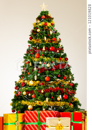 Vertical image of christmas tree with decorations and gifts with copy space background Vertical image of christmas tree with decorations and gifts with copy space background 121019828