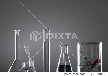 Close up of laboratory dishes and copy space on grey background Close up of laboratory dishes and copy space on grey background 121019892