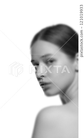 Contemporary art collage. Female gaze exuding calm and quiet beauty, focus on eyes. Blurred effect and monochrome filter. Contemporary art collage. Female gaze exuding calm and quiet beauty, focus on eyes. Blurred effect and monochrome filter. 121019933