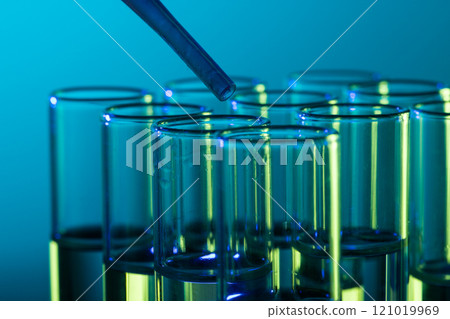 Close up of laboratory test tubes and pipette with copy space on blue background 121019969