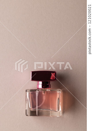 Vertical image of beauty product perfume bottle with copy space on brown background 121020021