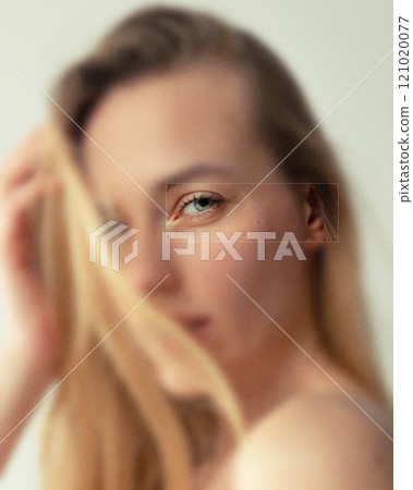 Contemporary art collage. Female eye gazing softly, exuding warmth and calm. Subtle gradients and smooth textures emphasize natural beauty in minimalist style. 121020077