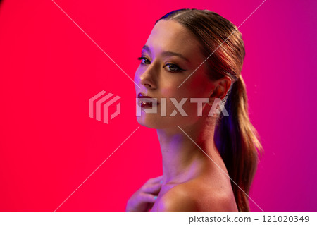 Caucasian woman wearing red lipstick and blue nail polish on pink background, copy space Caucasian woman wearing red lipstick and blue nail polish on pink background, copy space 121020349