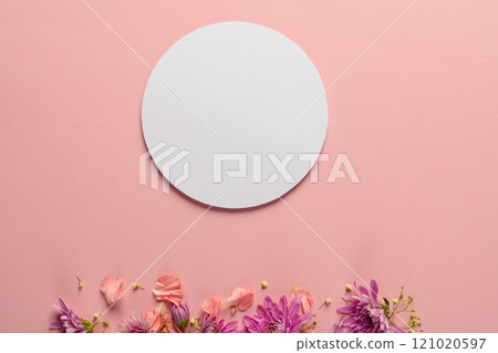 Pink flowers and white circle with copy space on pink background 121020597