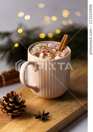 Vertical image of mug of chocolate and marshmallows and christmas decorations with copy space Vertical image of mug of chocolate and marshmallows and christmas decorations with copy space 121020806