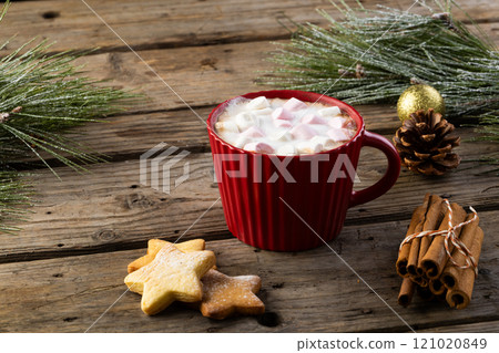 Red mug of chocolate and marshmallows and christmas decorations with copy space 121020849