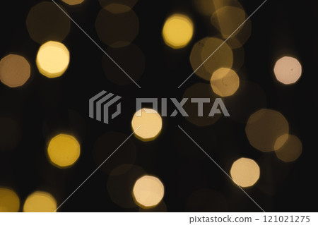 Multiple yellow bokeh lights with copy space on dark background Multiple yellow bokeh lights with copy space on dark background 121021275
