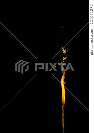 Close up of gas lighter with flames and copy space on black background 121021276