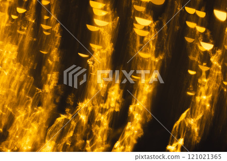 Yellow bokeh blurred lights with copy space on dark background 121021365