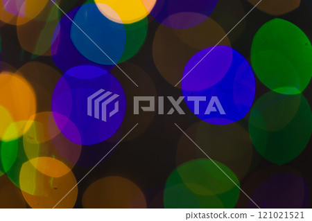 Multi coloured bokeh lights with copy space on dark background Multi coloured bokeh lights with copy space on dark background 121021521