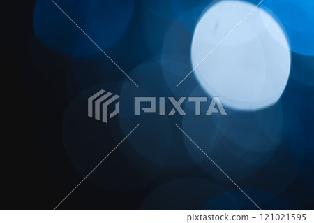 Blue bokeh lights with copy space on dark background 121021595