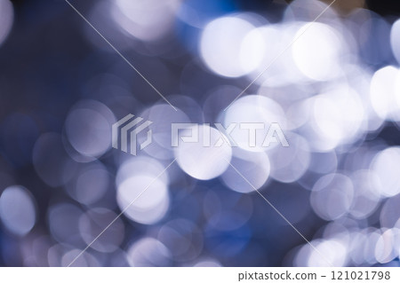 Blue bokeh lights with copy space on dark background Blue bokeh lights with copy space on dark background 121021798