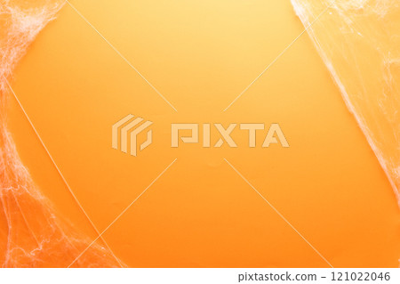 Halloween spiderweb decorations with copy space on yellow background Halloween spiderweb decorations with copy space on yellow background 121022046