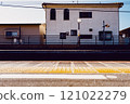 A train running through a residential area 121022279