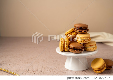 Macarons colorful cookies on a cake stand. Sweet dessert 121022326