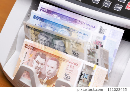 Jamaican dollar in the counting machine 121022435