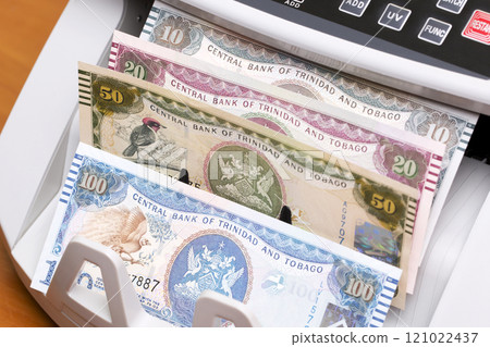 Trinidad and Tobago dollar in the counting machine 121022437