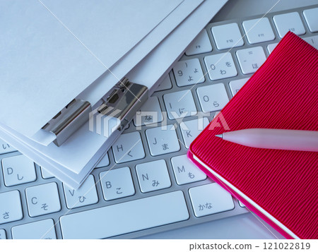 Documents, keyboard and notebook on the table 121022819