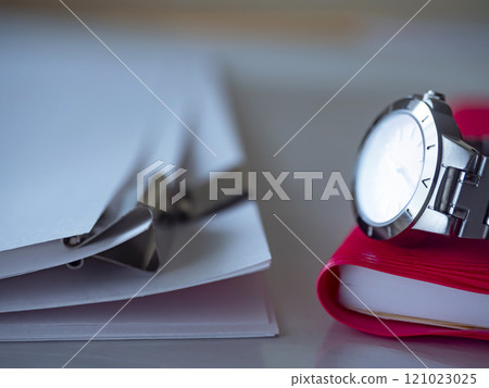 Documents, notebook and watch on the table Documents, notebook and watch on the table 121023025
