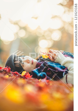 Autumn leaves and a young lady Autumn leaves and a young lady 121023168